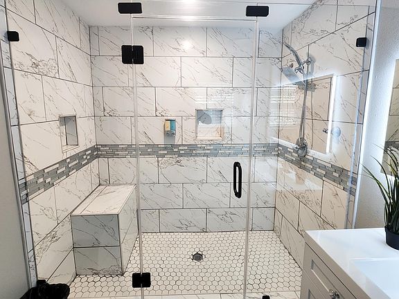 Attached Bathroom for Master Bedroom with Frameless Glass Shower, Water color changing Sink and Backlit Bathroom mirror with Anti-Fog capability.