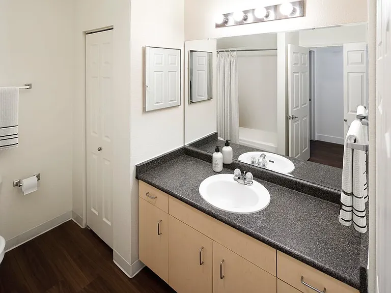 Classic Package I bath with oak cabinetry, laminate countertops, and hard surface flooring