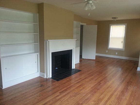 Front LR with hardwood floors, built in cabinets and gas log fireplace hookup.