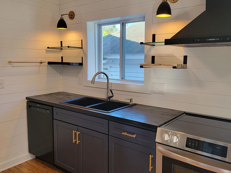 KITCHEN GREAT TASK LIGHTING WITH FLOATING SHELFS FOR STORAGE & ALL NEW APPLANCES!