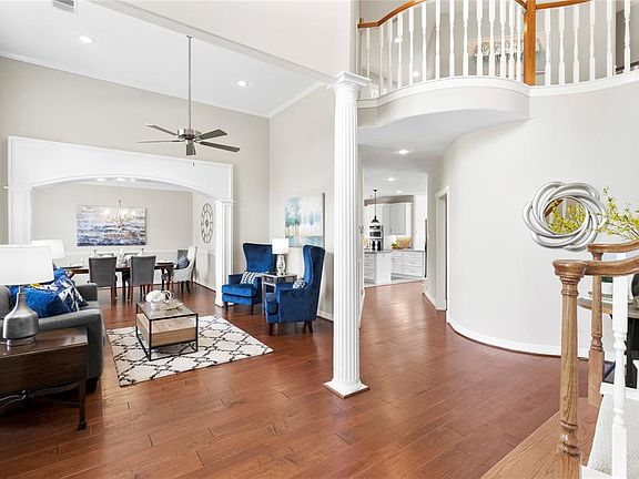 Living room with tall ceilings and custom trim woodwork.