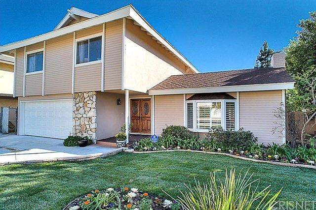 This two story family home is north facing with handsome curb appeal, a two car attached garage with direct home access, a cement driveway and front bay window.