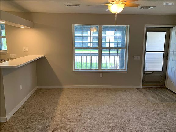 Spacious living room with new carpeting