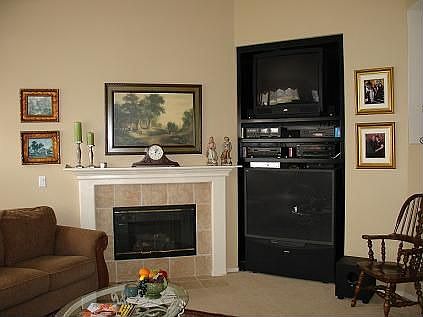 Family rm with FP and built in entertainment unit.