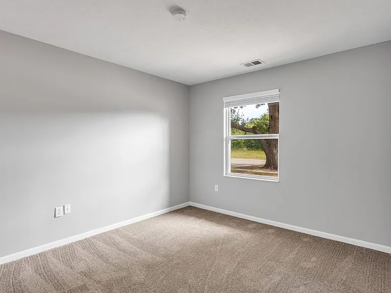 Comfortable bedrooms with plush carpeting and natural light create a peaceful retreat, professionally managed by Highlands Vista Group.