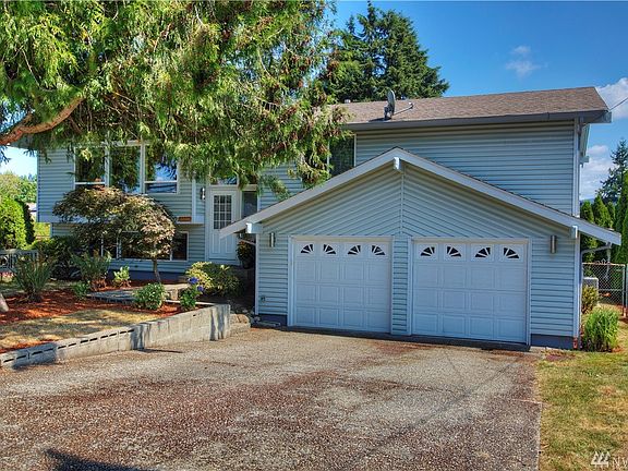 Big 2 car garage with an easy access to daylight basement with 2 bedrooms, 3/4 bath and utility room down. Also, extensive patio out slider.