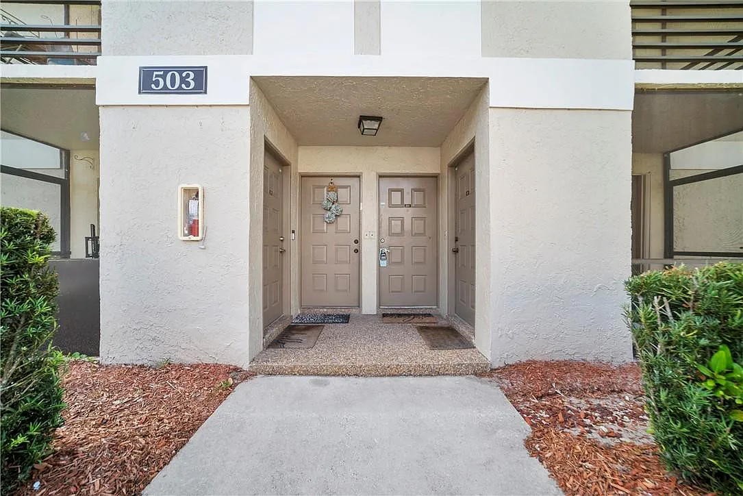 Building Photo - 503 Gardens Dr #202
