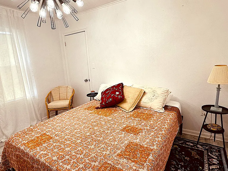 Bedroom 1 with adjoining half bath