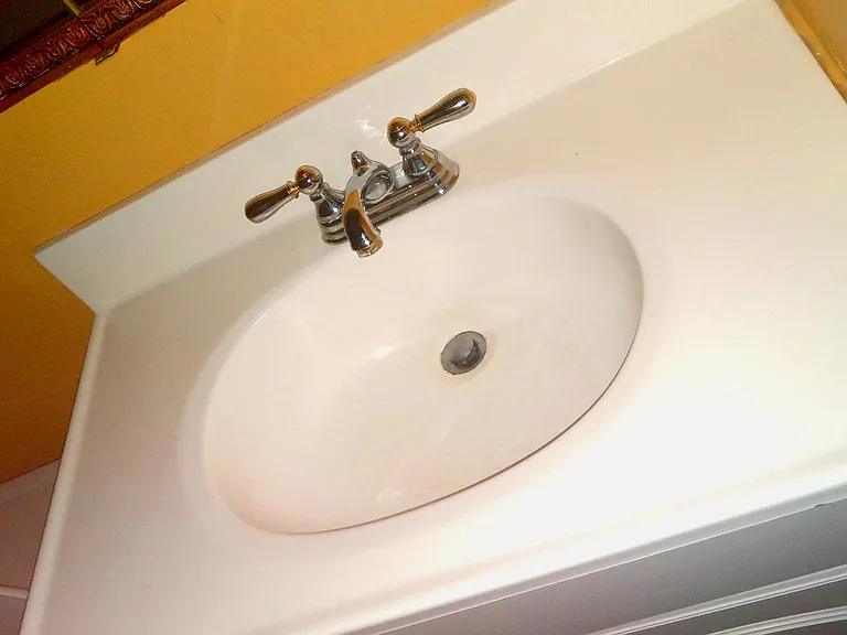 Vanity sink in first of two bathrooms