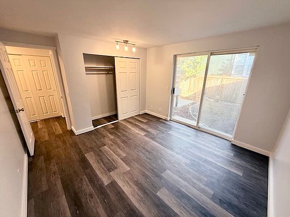 bedroom 1 with access to backyard and patio