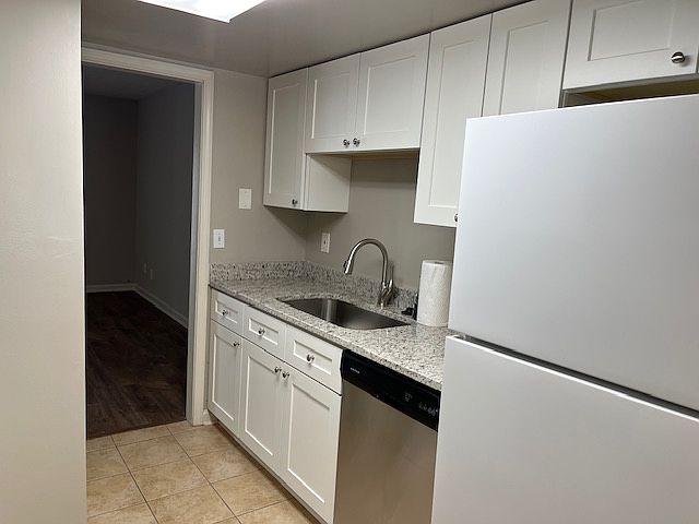 Galley kitchen with new cabinets w/soft-close doors and drawers. HUGE single hole sink with new faucet. Dishwasher and refrigerator. Small pantry in kitchen