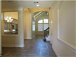 View of the gorgeous entry over looking through the dining to the Kitchen and a fantastic view of the backyard.