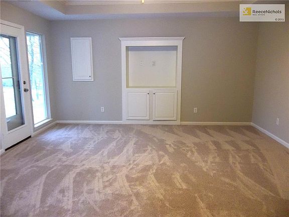 Large Living Room with Built-ins and new Carpet.
