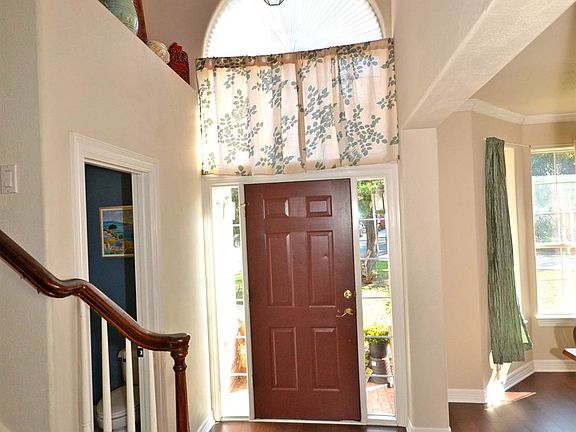 Natural light fills this grand two-story foyer.