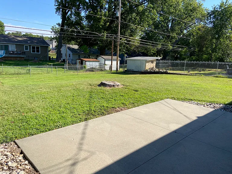 Backyard patio and fenced yard