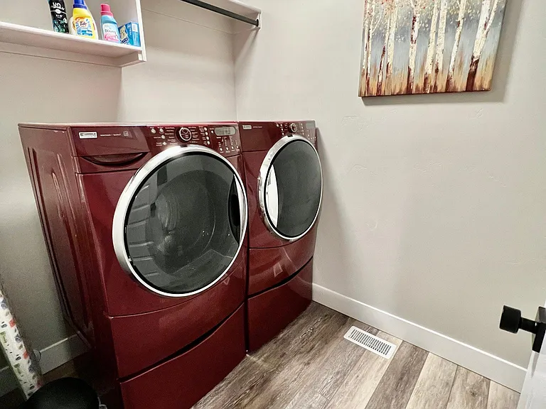 Laundry room upstairs (Where all the laundry is made) Iron & Ironing board provided as well.
