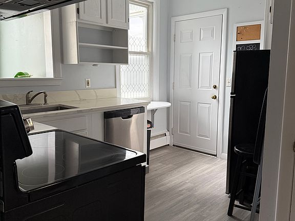 Kitchen from LR entrance. View of back entrance.