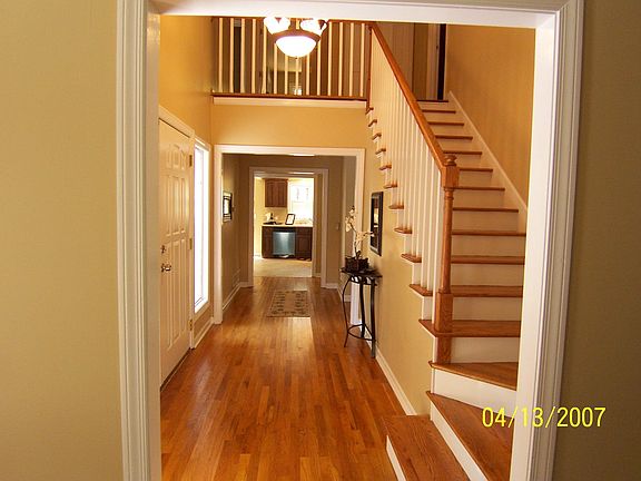 dramatic 2 story foyer with hardwoods throughout lower level!