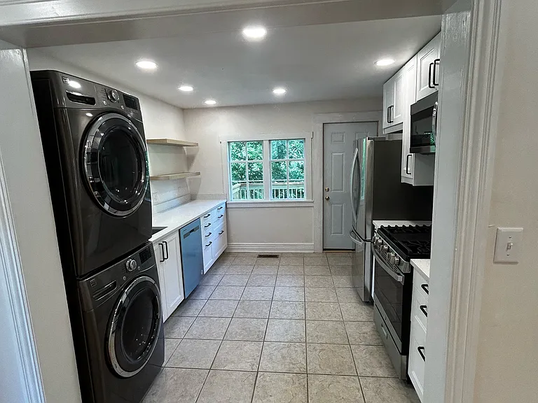 Door off kitchen leads to large, brand new deck - great for BBQ's, gatherings and outdoor dining
