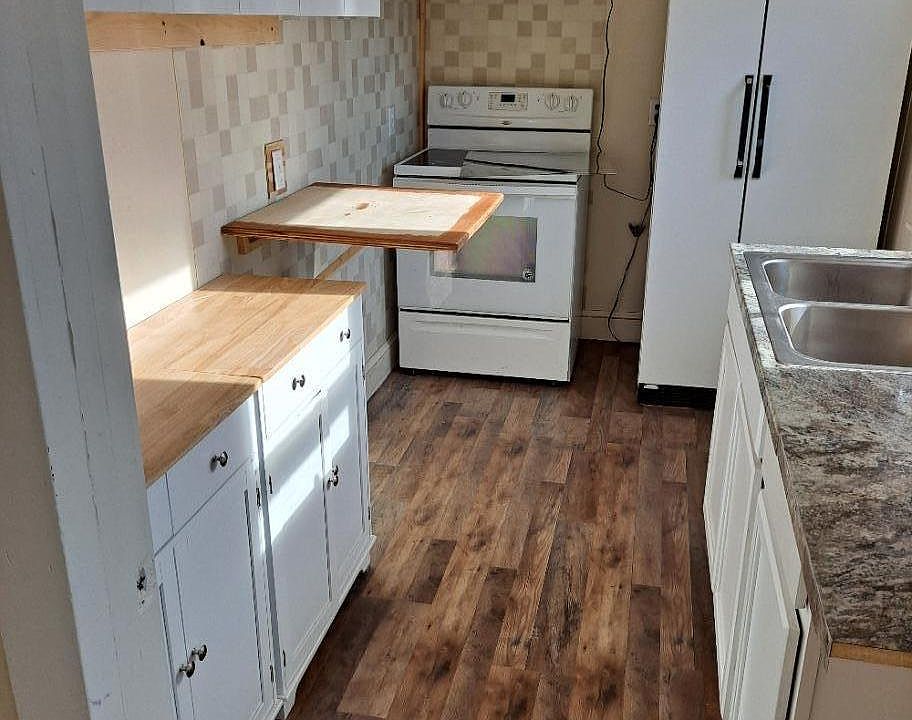 Kitchen featuring the Murphy counter., all new cabnits, sink, floor and walls