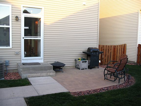 back yard looking away from garage.  brick paver patio and cedar fenced yard.