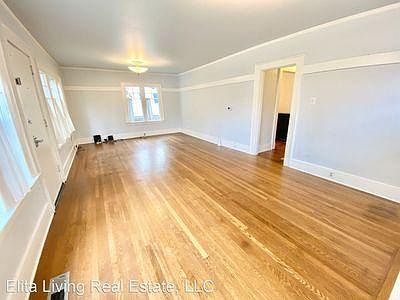 Light-filled upstairs living room with wood floors (throughout entire top floor).