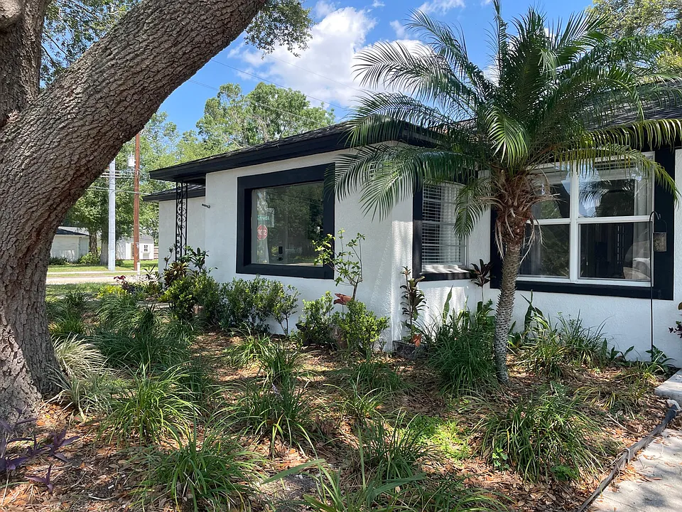 Enjoy the view with a large picture window and palm tree view from the dining table