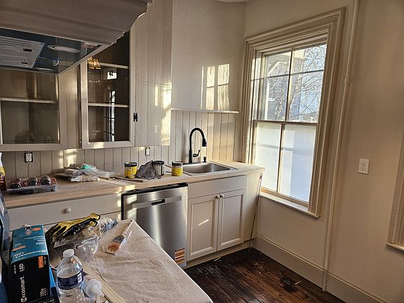 Under construction in this photo, the kitchen gets lots of natural light through its large windows