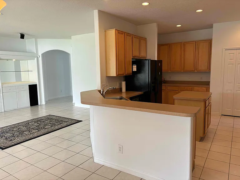 Spacious kitchen with island and abundant cabinet storage space