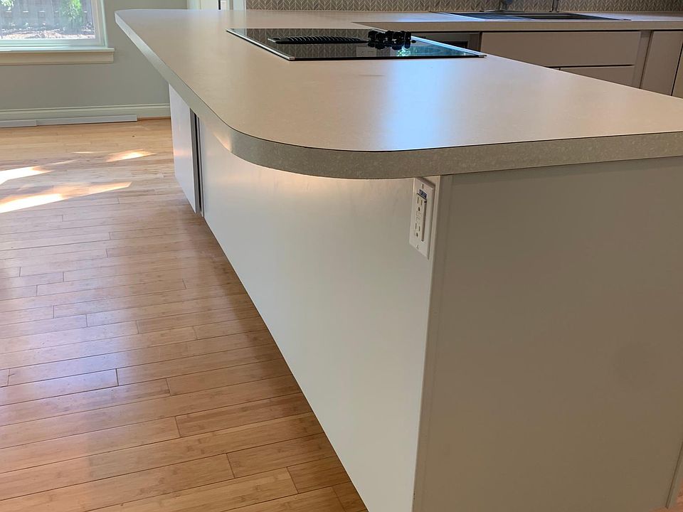 Breakfast bar and access to deck and garden.