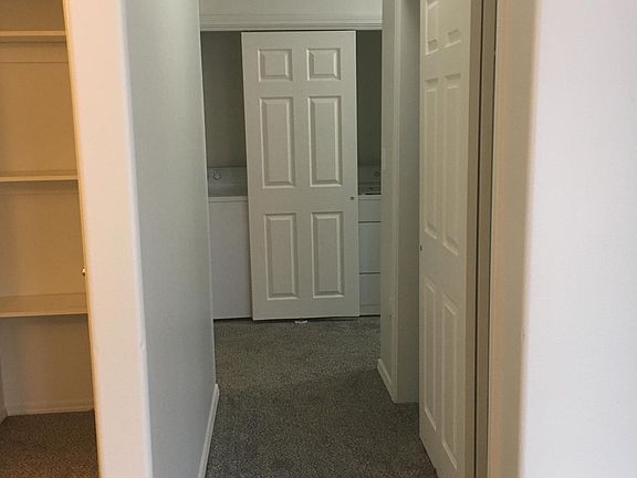 Hall, view from living room, Formal dining room to the left with additional closet space.