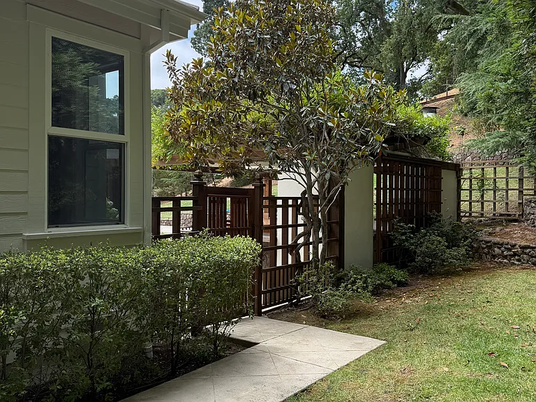 Access to backyard from driveway and side kitchen door