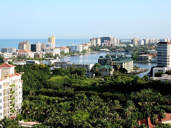 Rear view from balcony looking out over Vanderbilt Beach and the bay