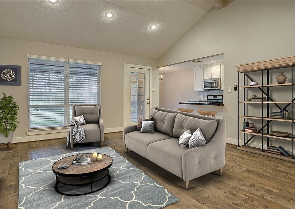 Virtually Staged - Welcome to 5923 Spellman! This is one of two living areas in the home. The home is a 3 BR/2BA traditional brick one-story and sits on a large lot with beautiful trees. It has a great layout and floor plan.