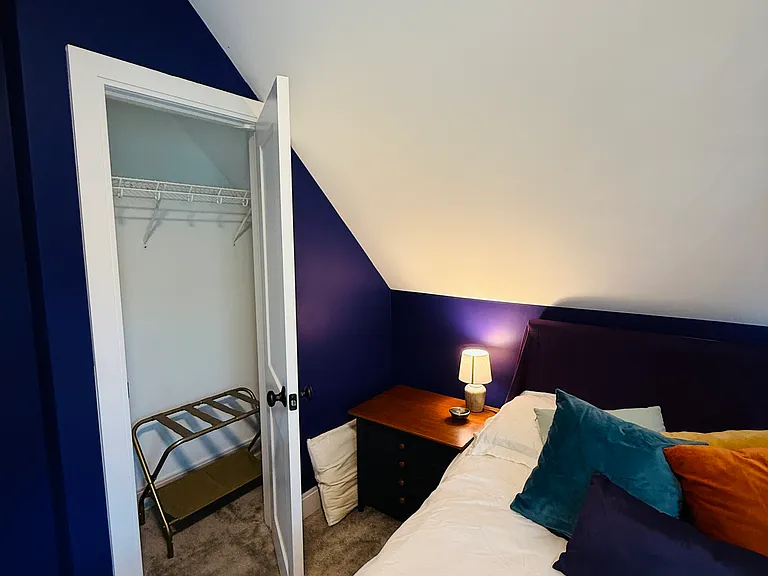 Closet with luggage rack.