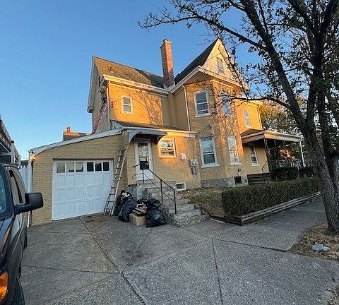 side front with parking spaces and garage