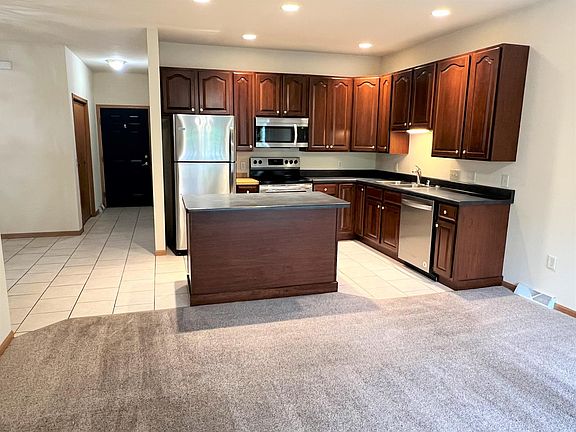 Garage access, coat closet, laundry room down the hall