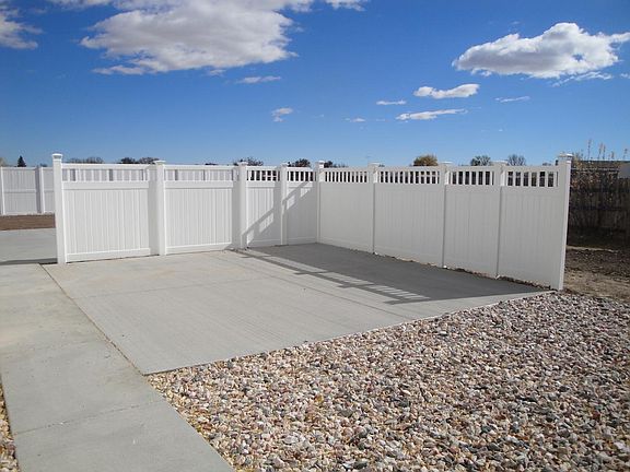 Private fenced concrete patio.
