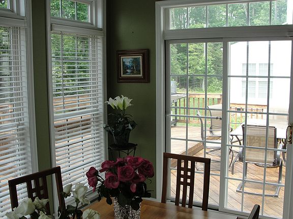 Enjoy your view from the sun room, looking out to the multi tiered deck