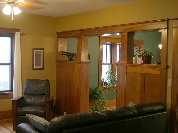 Classic design of the era
						:
						Wooden colonnades offer a handsome transition between rooms on the main floor