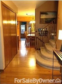 Foyer, with hardwood floors