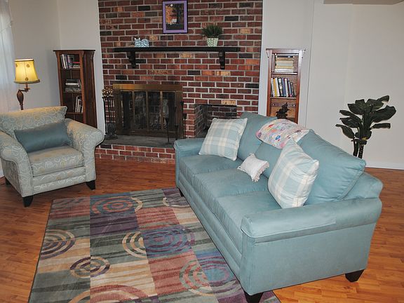 Ground level family room w/ brick fireplace