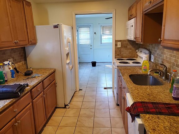 Kitchen leading to spare BR and 2nd bath
