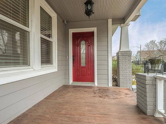 Welcoming front porch is a perfect spot to sit and enjoy the neighborhood.