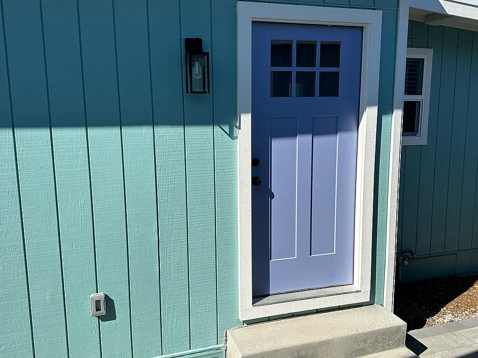 Enjoy your privacy in this newly renovated and updated stand alone home. It feels cozy and bright with all of the amenities. The purple door entry is fun and inviting.