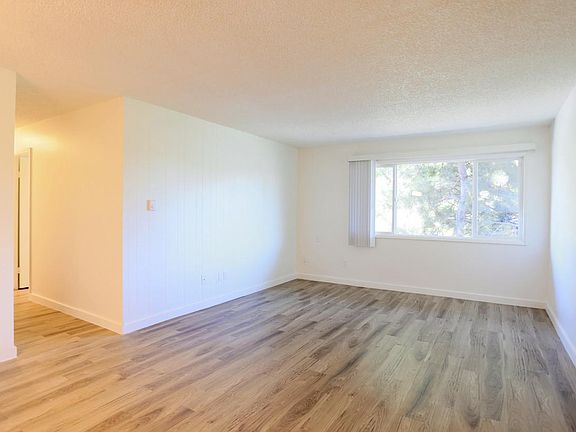 Two Bedroom Living Room Without Decorative Fireplace