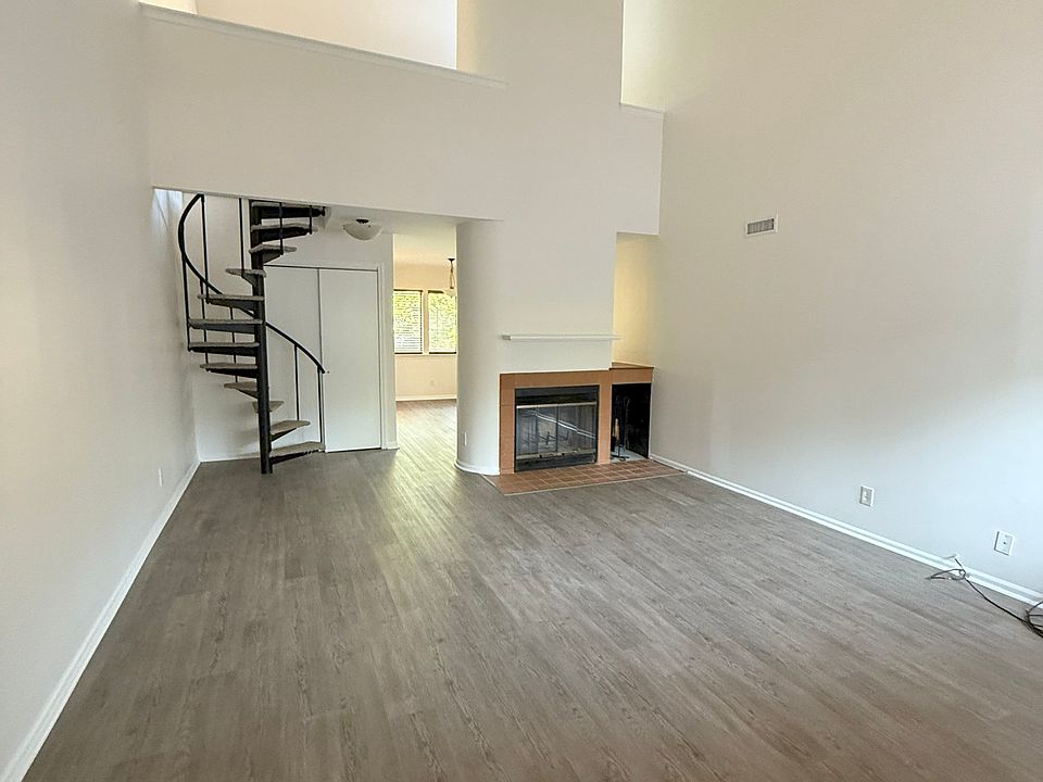 Upon entering you can see the living room, fireplace, stairs to loft and loft. (WOW!!)