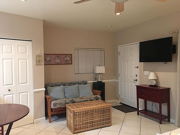 sitting area, SMART TV swivels for viewing. One door goes out to the driveway, the other to your walk in closet
