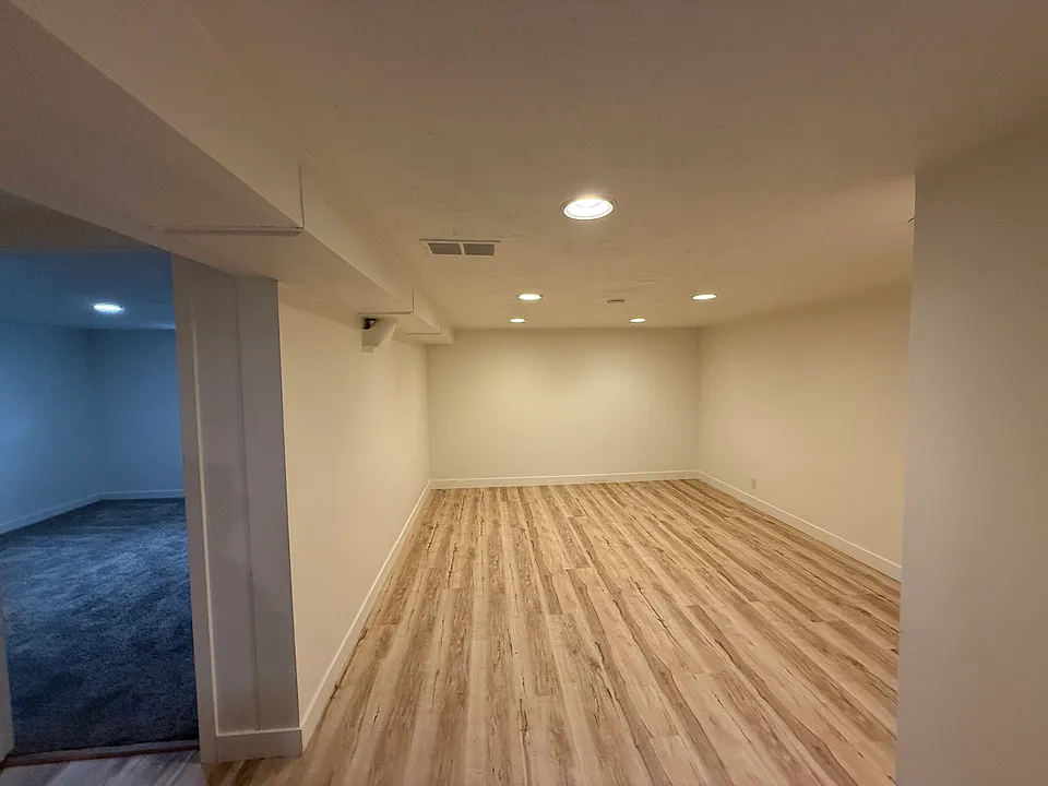 Spacious living room with recess lighting