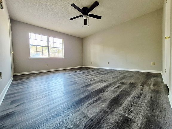 Spacious master bedroom with two closets and plenty of natural light_ample room for storage and furniture.